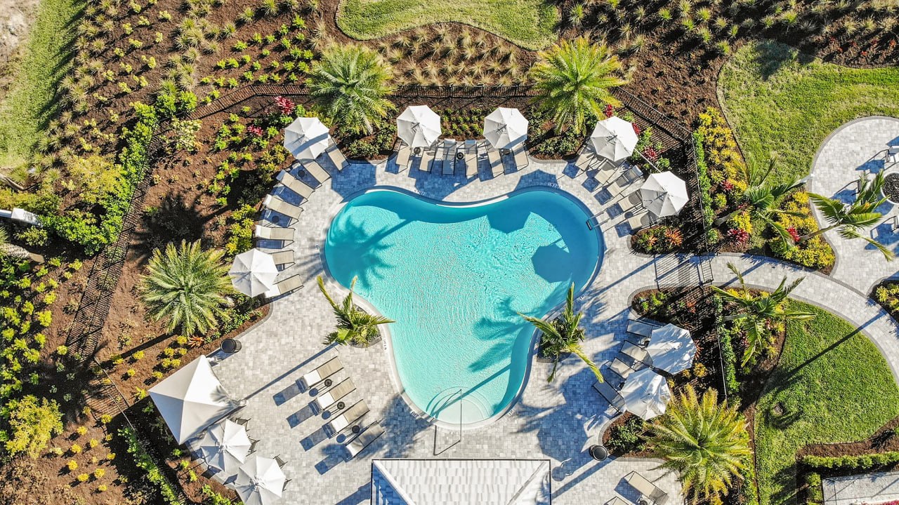 Resort-style pool and amenity area at Esplanade at Rivergrass in Naples Florida